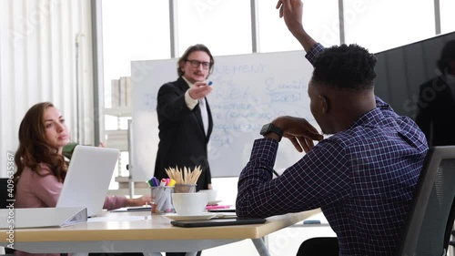 Diversity business marketing group people meeting discussing sale and business plan in office, Black young male staff raise hand asking question in meeting, Professional team brainstorming concept
