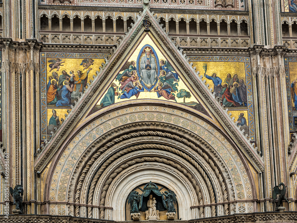 Detail of the facade of the basilica of Orvieto decorated with mosaics