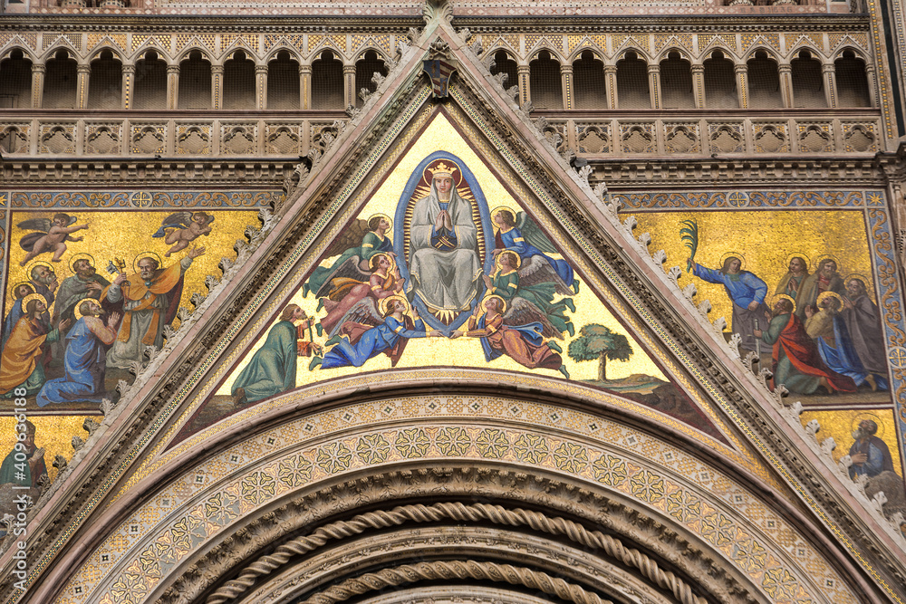 Detail of the facade of the basilica of Orvieto decorated with mosaics