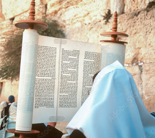 Photo Lifting up the Torah scroll at the Western wall for Jewish holiday of Simchat To