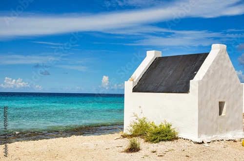 slave houses on the beach in bonaire in the caribbean photo