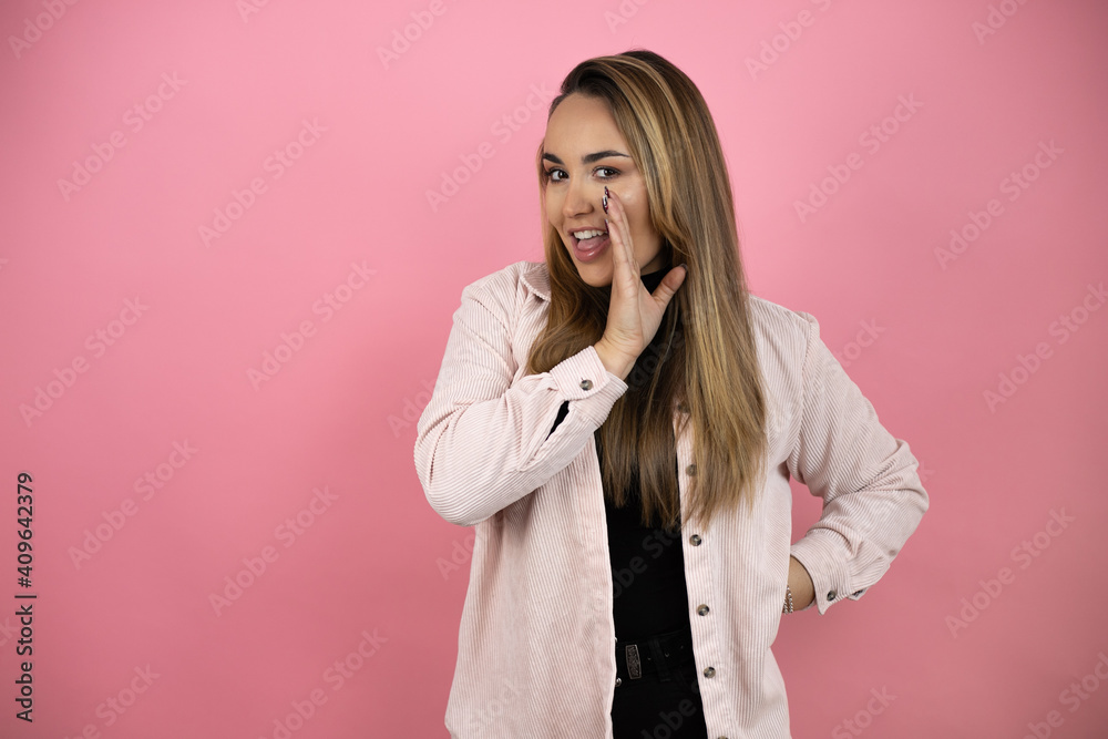 Young beautiful girl over ink background telling a secret Young beautiful girl over ink background telling a secret