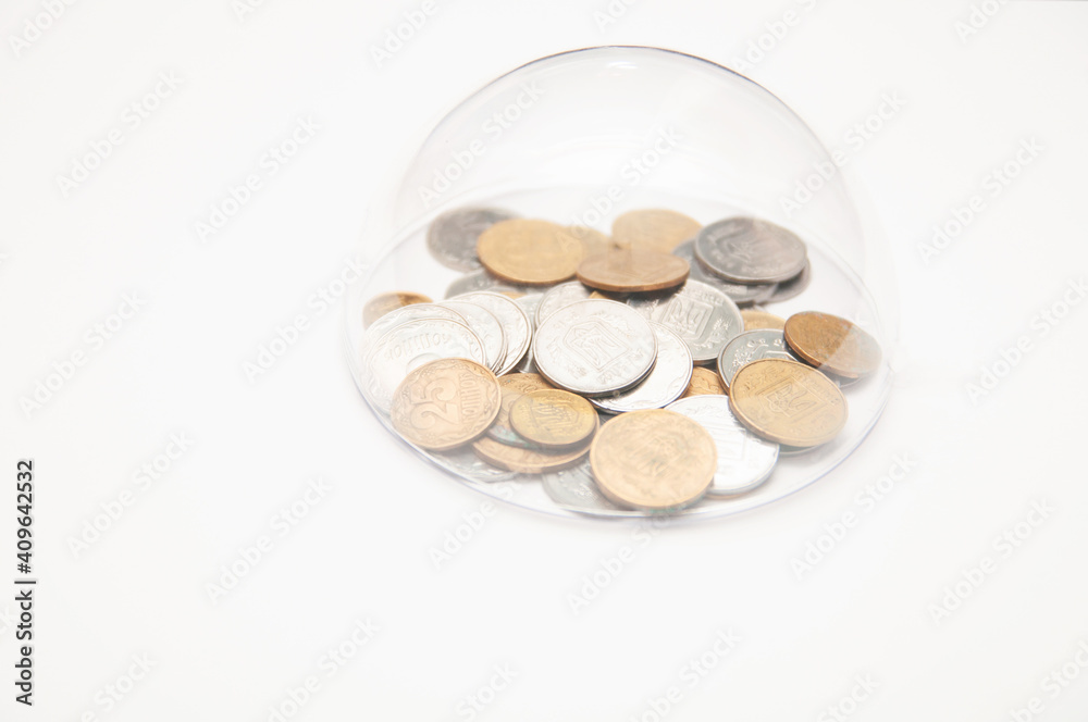 metal coins are grouped under a glass semicircle metal coins are grouped under a glass semicircle