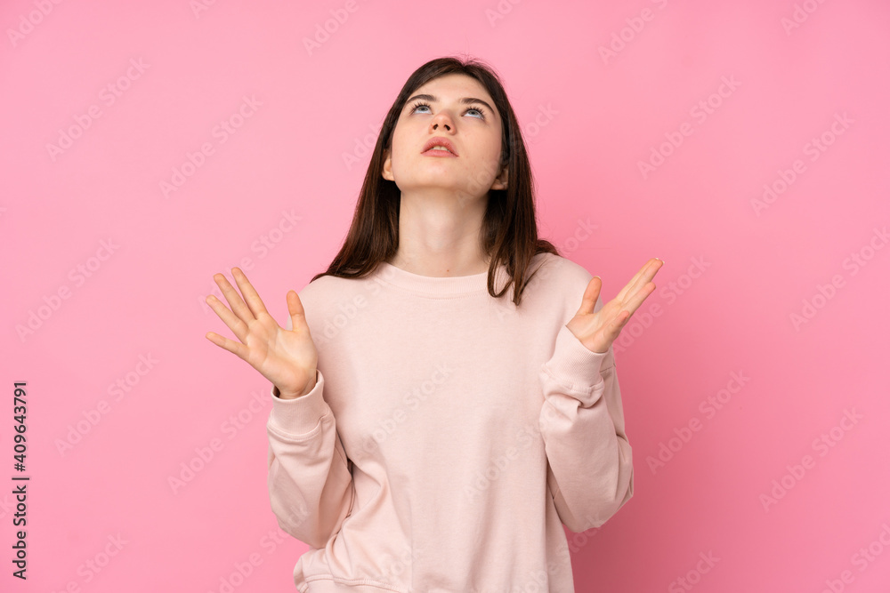 Young Ukrainian teenager girl over isolated pink background frustrated by a bad situation Young Ukrainian teenager girl over isolated pink background frustrated by a bad situation