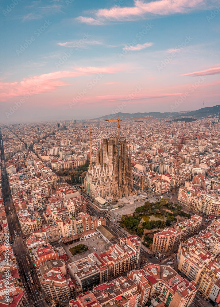 Aerial drone shot of Barcelona city center with Montjuic in early morning