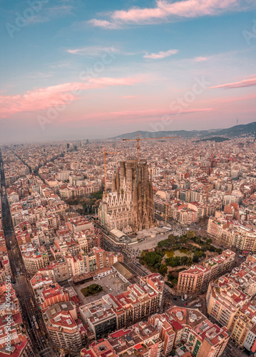 Aerial drone shot of Barcelona city center with Montjuic in early morning