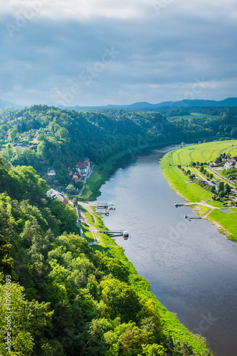 Ferry crossing on river Elbe, small ferryboat transporting tourists to Bastei Bridge hiking route. photo