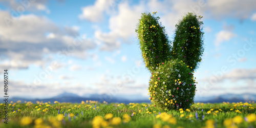 Tableau sur toile Easter bunny made of spring grass and flowers on green meadow.