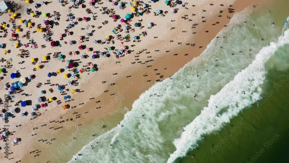 Aerial view of Copacabana beach with beach umbrellas and sun loungers. Rio de Janeiro, Brazil. Aerial view of Copacabana beach with beach umbrellas and sun loungers. Rio de Janeiro, Brazil.