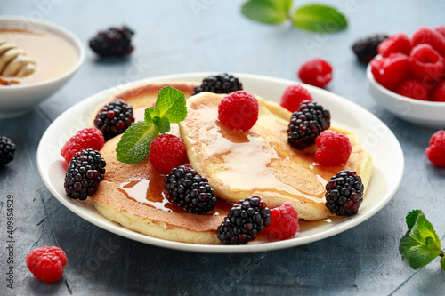 Morning breakfast Pancakes with fresh berry and honey. Healthy food