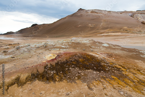 Colourful landscape with steam rising from the earth in the Hverir geothermal park near lake Myvatn, Iceland