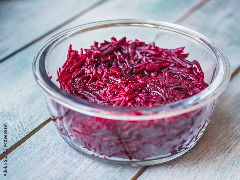 Boiled beets grated in long strips in a glass container Boiled beets grated in long strips in a glass container