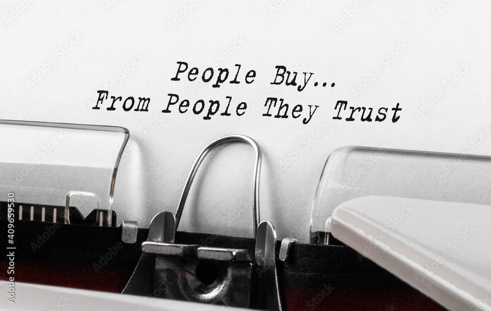 Text People Buy From People They Trust typed on retro typewriter