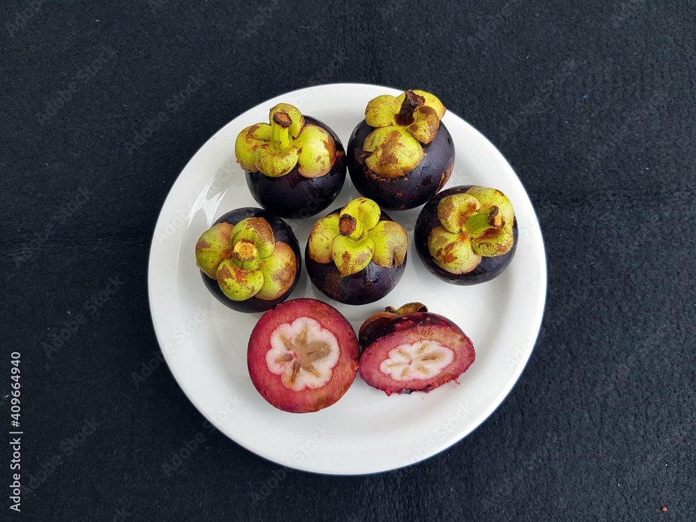 Mangosteen (Garcinia mangostana), also known as the purple mangosteen