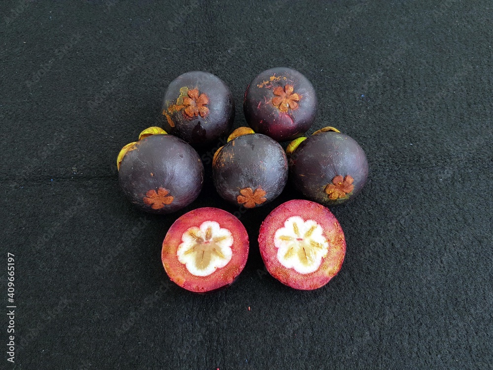 Mangosteen (Garcinia mangostana), also known as the purple mangosteen