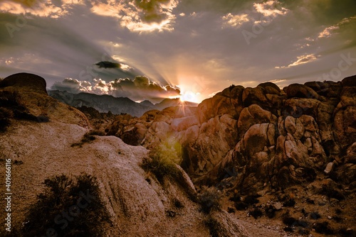 Brown rocky mountain under gray clouds photo