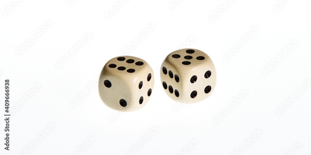 A pair of white dice thrown with the number eleven isolated on a white background A pair of white dice thrown with the number eleven isolated on a white background