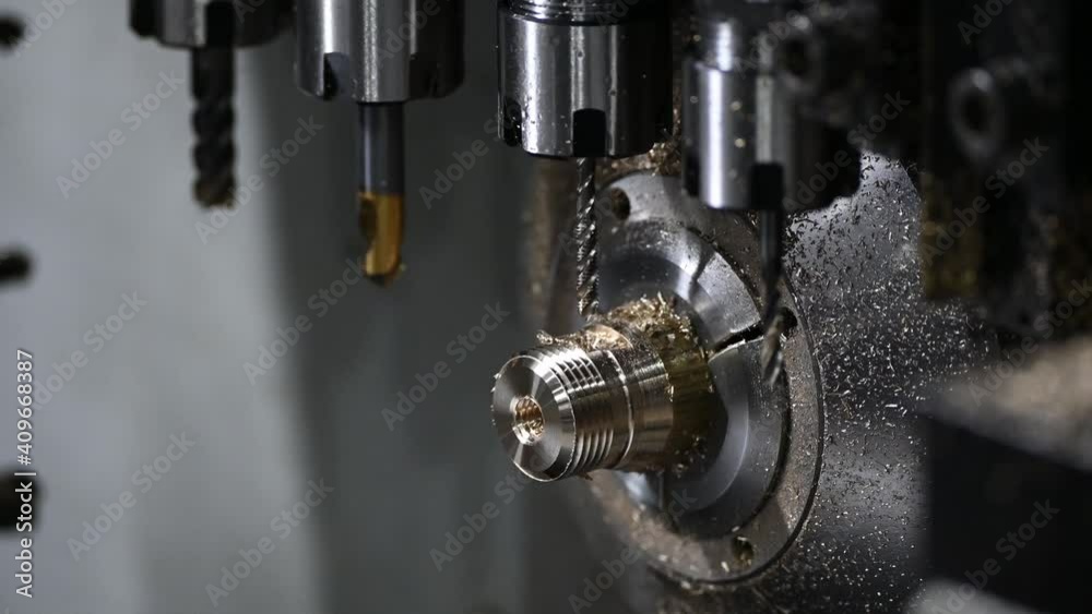 The  operation of multi-tasking CNC lathe machine cutting the fitting part. The hi-technology pipe connector parts by CNC turning machine.