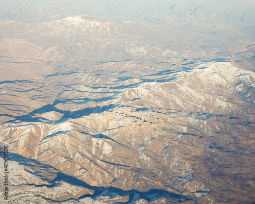 Flight over the Caucasus mountains by plane.
