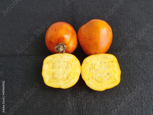Yellow Solanum sessiliflorum fruits or Cocona is a tropical shrub belonging to the Solanaceae family. Amazon, Brazil photo