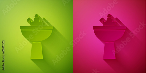 Paper cut Washbasin with water tap icon isolated on green and pink background. Paper art style. Vector.