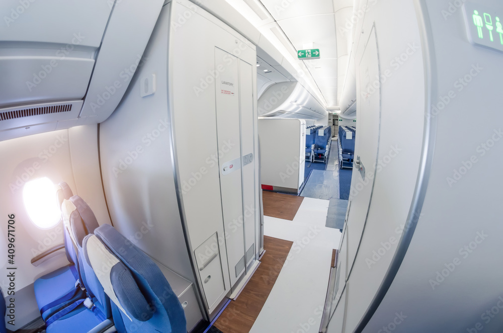 Passage on a passenger plane next to the toilet in economy class. Passage on a passenger plane next to the toilet in economy class.