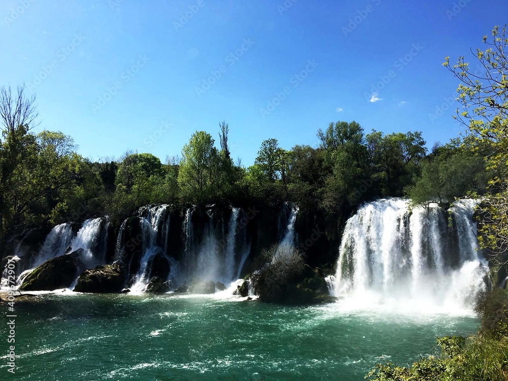 Kravica waterfalls is a large tufa cascade on the Trebižat River, in the karstic heartland of Herzegovina in Bosnia and Herzegovina. Kravica waterfalls is a large tufa cascade on the Trebižat River, in the karstic heartland of Herzegovina in Bosnia and Herzegovina.