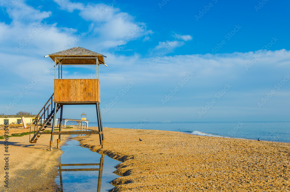 A sandy beach washed away by a storm. A sandy beach washed away by a storm.