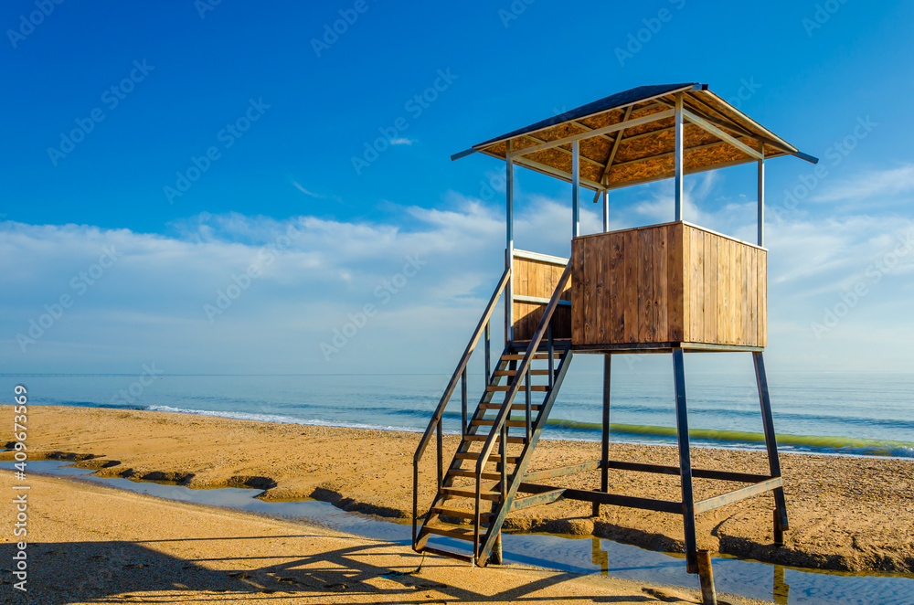 Lifeguard tower on an empty sandy beach. Lifeguard tower on an empty sandy beach.
