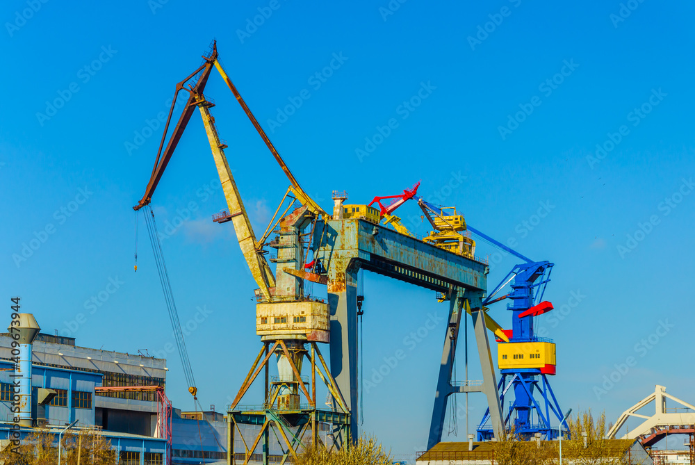 Large gantry cranes at the shipyard. Large gantry cranes at the shipyard.