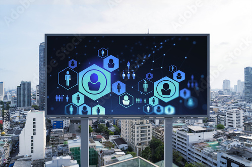 Glowing Social media icons on road billboard over panoramic city view of Bangkok, Southeast Asia. The concept of networking and establishing new connections between people and businesses.