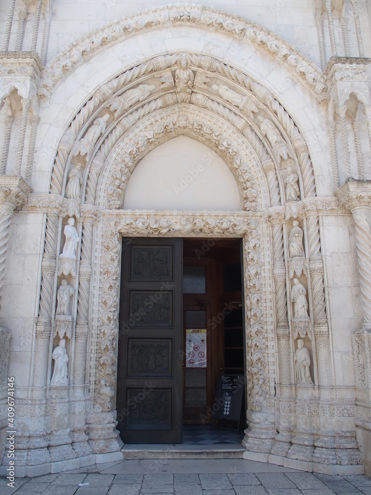 The entrance portals of the Church of St. Jacob in Sibenik, Croatia, show bible scenes