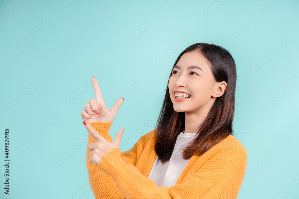 Dental of young asian woman wearing retainer braces glad emotion with white teeth increase confidence for healthy on blue background isolated, Happiness teenager smiling facial expression. Dental of young asian woman wearing retainer braces glad emotion with white teeth increase confidence for healthy on blue background isolated, Happiness teenager smiling facial expression.