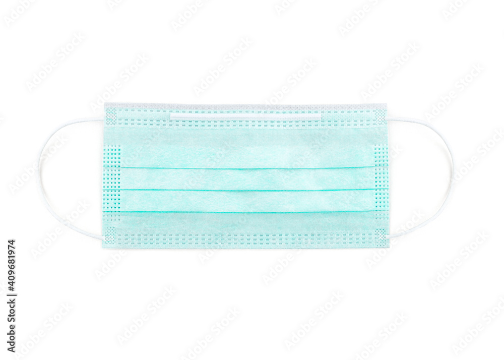 Green protective face mask. Disposable medical face mask isolated on white background closeup. Covid-19, pollution, corona virus and flu protection concept. Professional surgical equipment. Green protective face mask. Disposable medical face mask isolated on white background closeup. Covid-19, pollution, corona virus and flu protection concept. Professional surgical equipment.