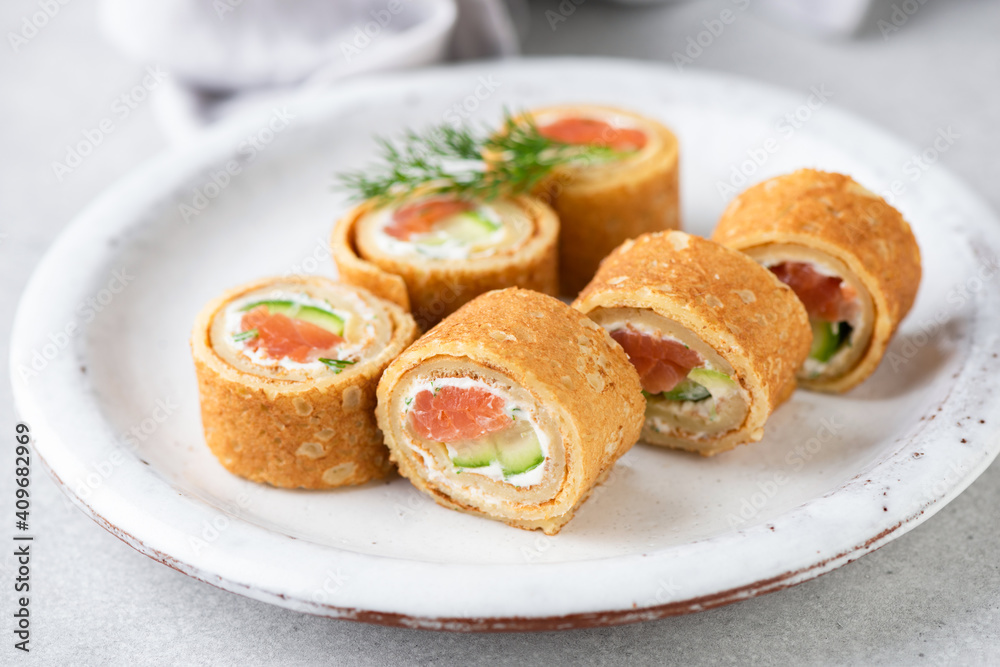 Crepe salmon rolls with herbed cream cheese. Appetizer party food