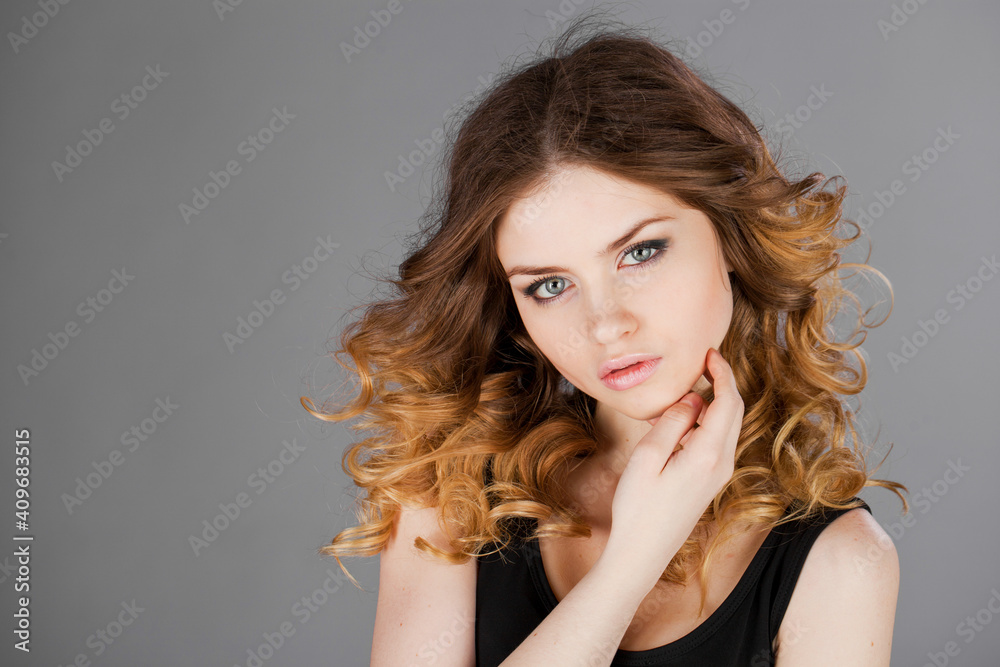 Beauty portrait of young blonde woman, isolated on gray background Beauty portrait of young blonde woman, isolated on gray background