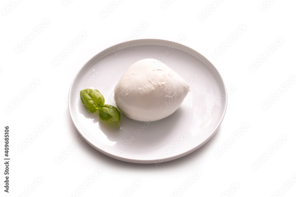 dish with typical Italian mozzarella and basil leaves, on white background