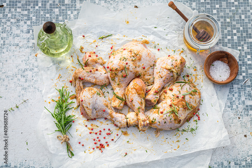 Slika na platnu Seasoning raw chicken legs with honey, salt and herbs