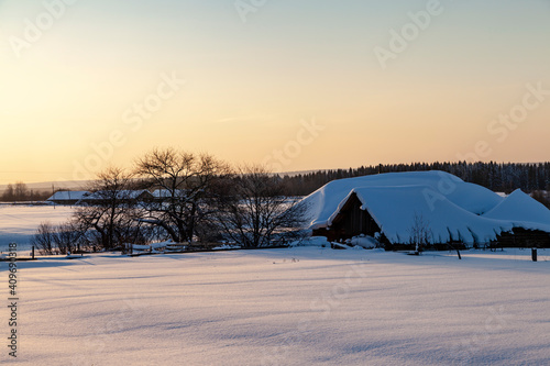 Winter landscape with a house