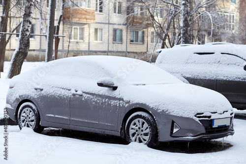 Car covered with fresh winter snow