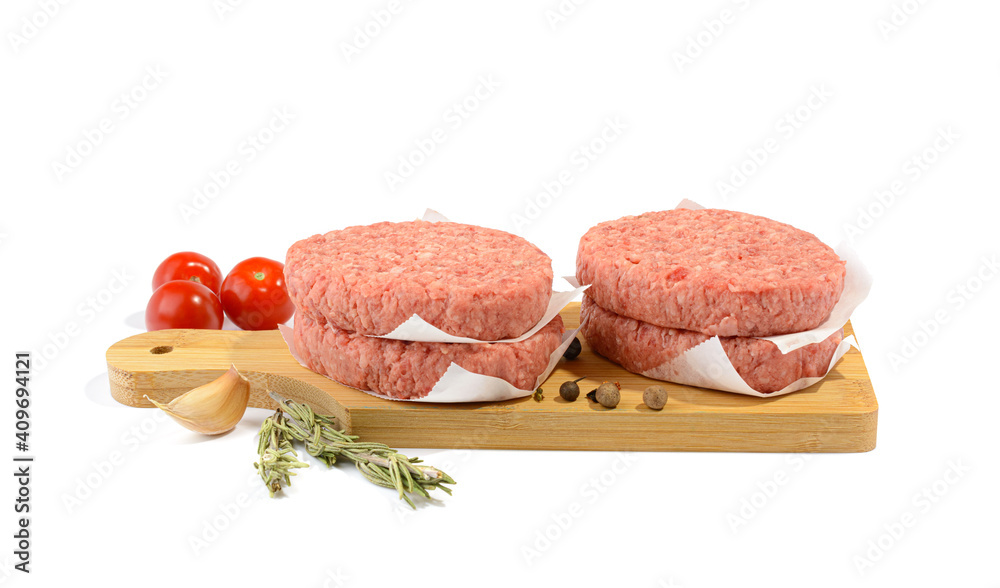 Raw beef patties for making a burger.Isolated on a white background.Selective Focus. Raw beef patties for making a burger.Isolated on a white background.Selective Focus.
