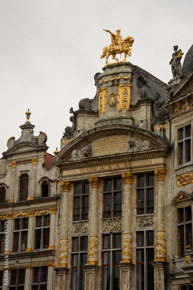 Brussels (Bruxelles), Belgium. Belgium. August 17, 2019: Maison de brasseurs on the Grand Place. Golden statue of Charles de Lorraine on the top.