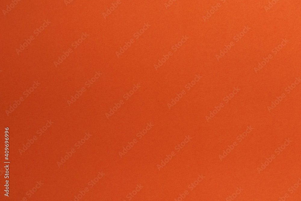 Fototapeta premium Close up Mottled orange paper background and texture. Orange paper with stripes of paper.