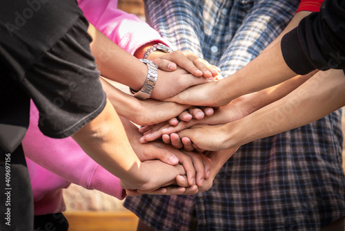 Business friend colleagues hand join together for successful business achievement. Young businesspeople putting their hands together. Stack of hands. join for success. teamwork concept.