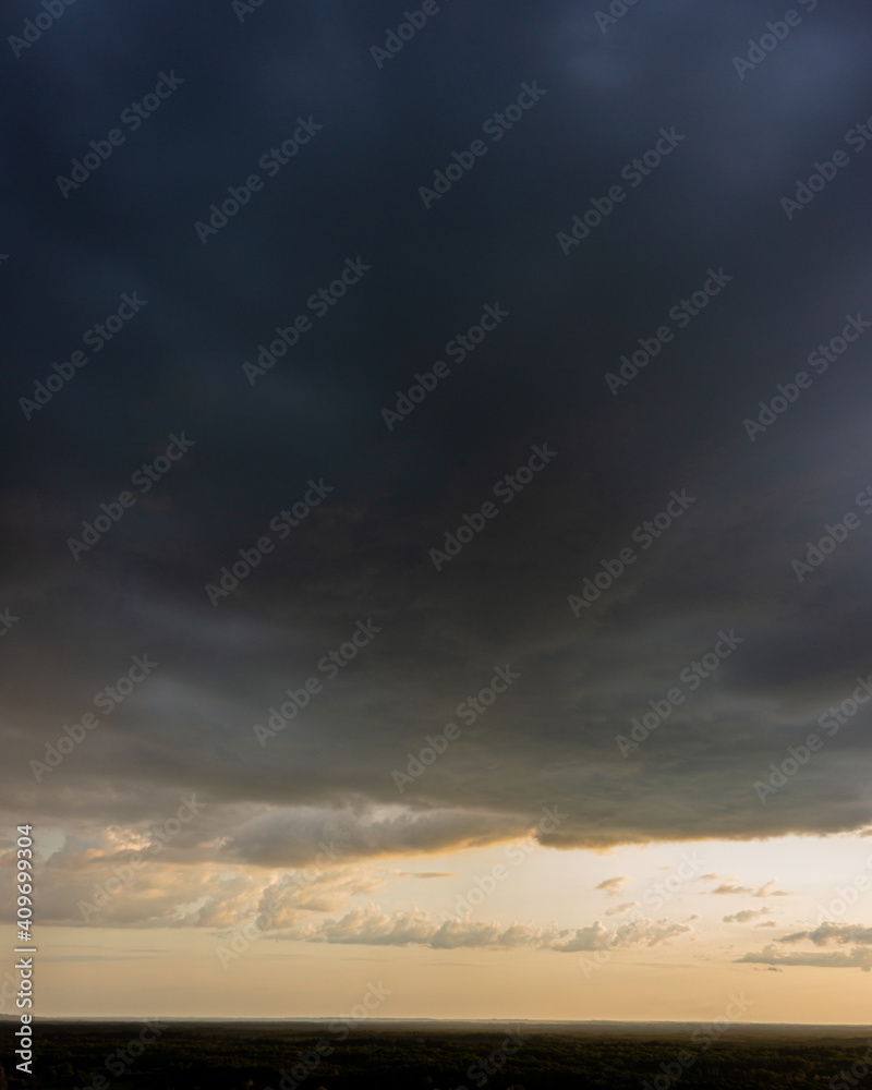 Evening sky and rain clouds, countryside landscape.
