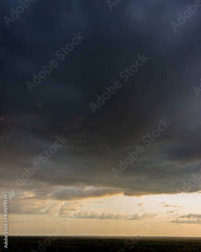 Evening sky and rain clouds, countryside landscape.