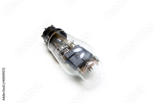 The single vacuum or electron tube isolated on a white background. The obsolete electronic device for current control. 