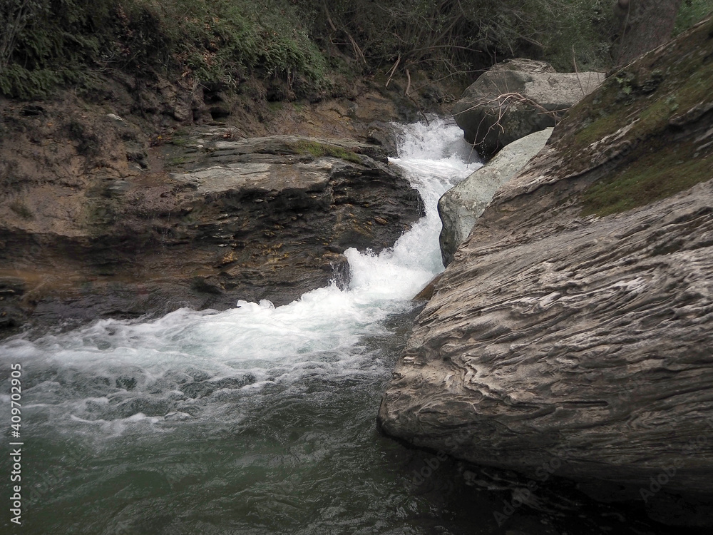 Naklejka premium Gurgling stream in gorge in Euboea island, Greece.