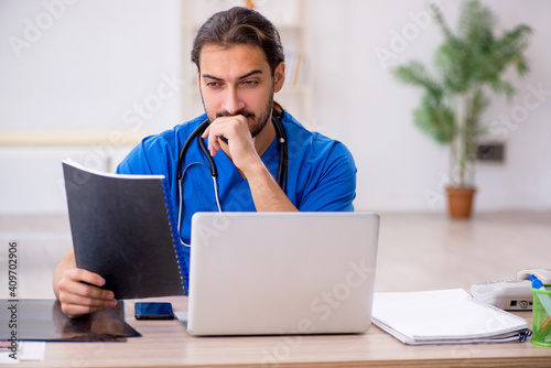 Young male doctor working in the clinic