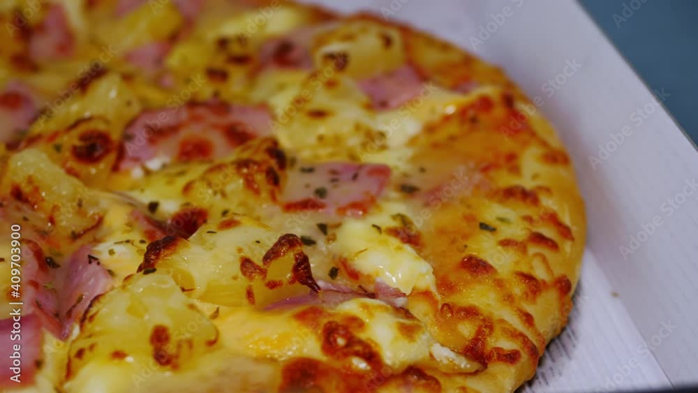 Sausage and Ham Cheese Pizza. The pizza in the delivery box was delivered on the marble tabletop. Sausage and Ham Cheese Pizza. The pizza in the delivery box was delivered on the marble tabletop.